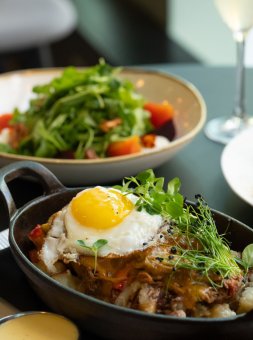 Restaurant table with several dishes and drinks