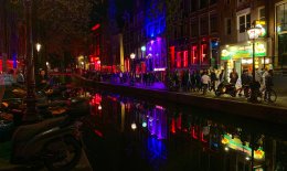 Busy street at night in Amsterdam