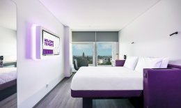 YOTEL Cabin design including a bed, bathroom and a window with a city view