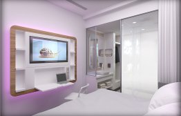 YOTEL New York - Solo room looking at the SmartTV, corner of the bed and bathroom/shower area