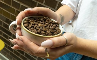 Coffee beans in a coffee mug