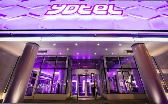 YOTEL New York - Entrance and signs lit up at night