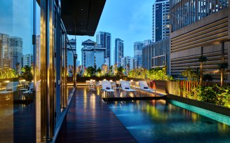 YOTEL Singapore swimming pool evening view