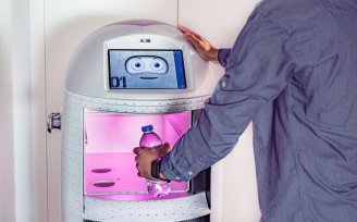 YOTEL Porto - Guest ordering water from the concierge robot