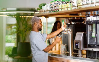 Man pouring beer from Grab + Go