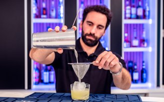 Bar person making cocktails 