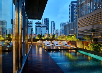 YOTEL Singapore swimming pool evening view