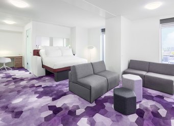 YOTEL Amsterdam - VIP Suite bedroom and lounge