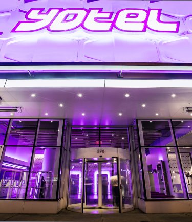 YOTEL New York - Entrance and signs lit up at night