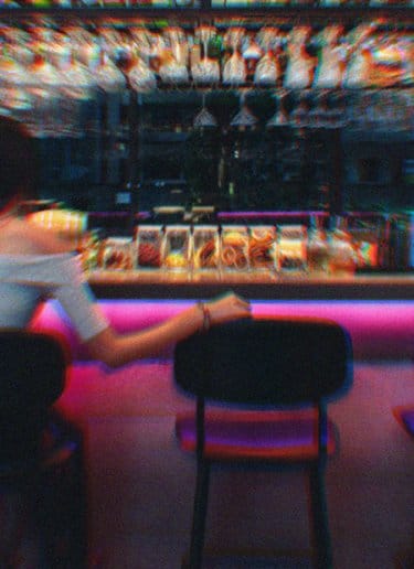Friends sharing drinks in bar 