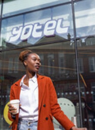 Woman in front of hotel 