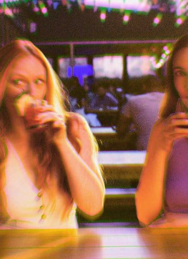 Two women drinking at YOTEL New York Times Square