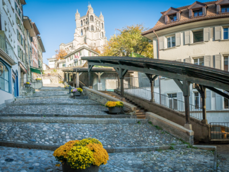 Cobbled stones, a church and old buildings of Lausanne
