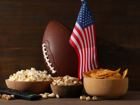 An American flag, an American football, and plenty of snacks