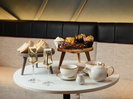 Afternoon tea, featuring sandwiches, cakes, coffee and prosecco 