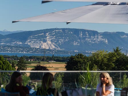 A sweeping view of the Swiss alps from an outdoor eating area