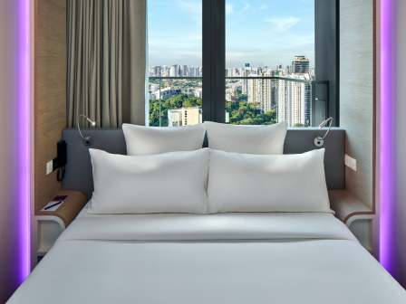 A SmartBed with views of the city behind it