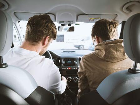 Two men park in a carpark