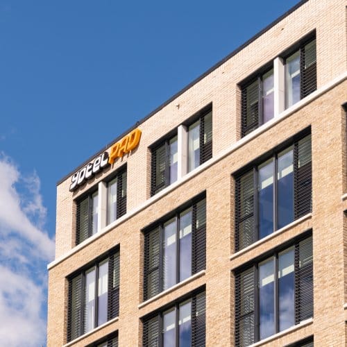 Top of hotel building showing YOTELPAD logo