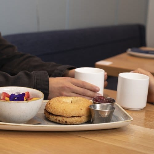 Breakfast bagel, tea and coffee