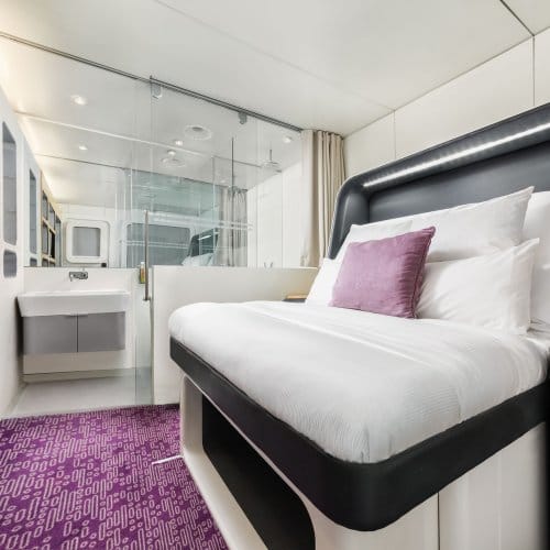 Studio room with purple carpet, a SmartBed and ample storage space