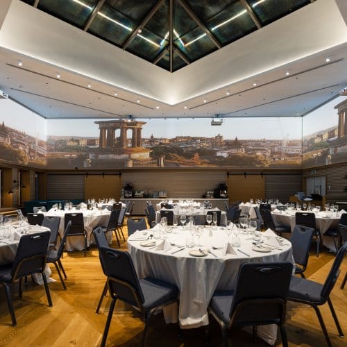 A large event space with a 360 degree screen