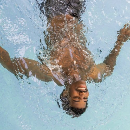 A man relaxes in a swimming pool