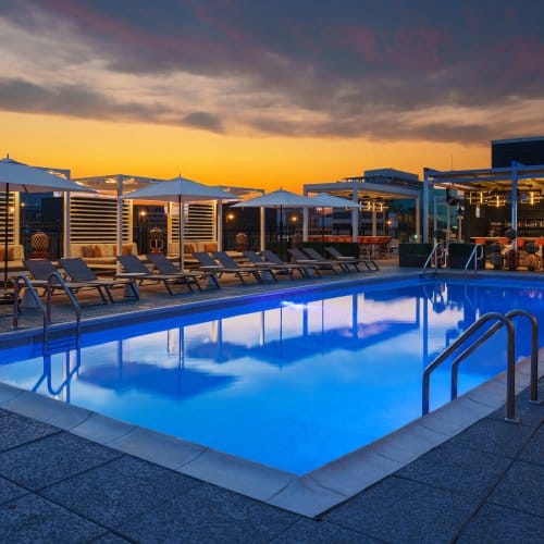 A serene rooftop pool seen at night