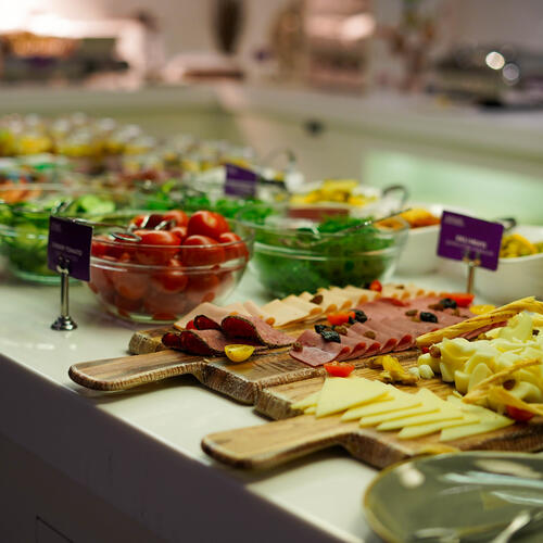 YOTEL Istanbul Landside continental style buffet breakfast with cheese, ham and salad on display