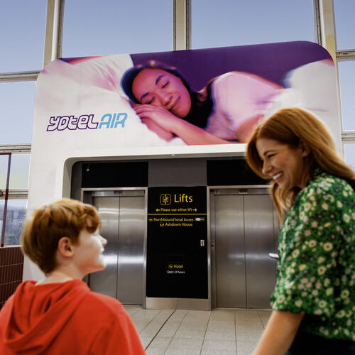 YOTELAir London Gatwick entrance with mother and son ready to go inside