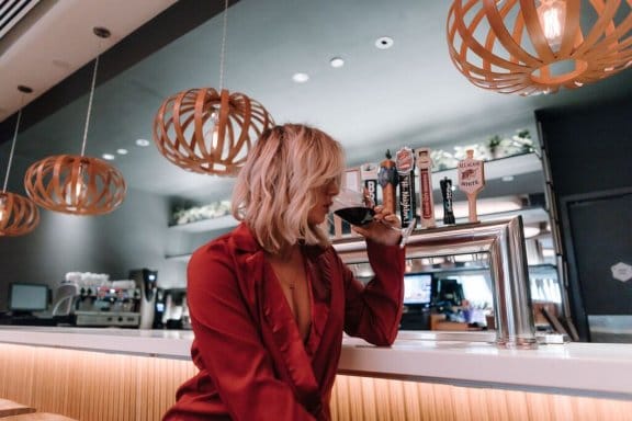 YOTEL New York - guest drinking wine