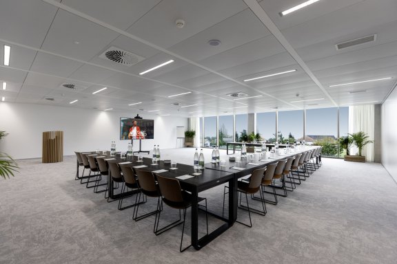  A meeting room with tables and views looking over the lake