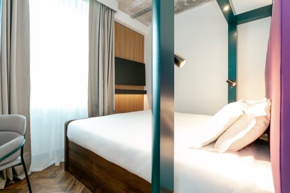 View of King Room with bed in middle