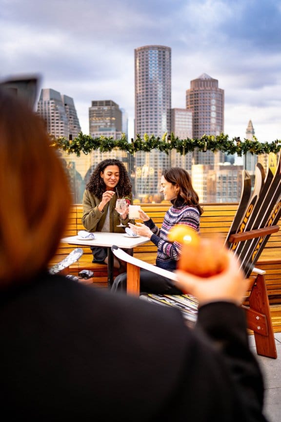 Women on a terrace drinking cocktails