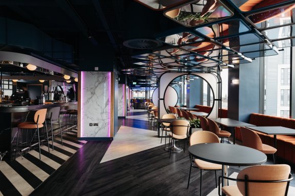 Restaurant and bar interiors with city views