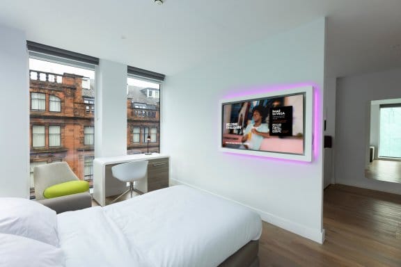 Hotel room with TV and large windows