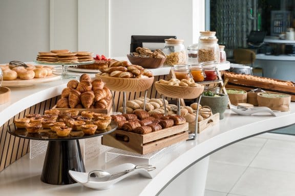 Buffet displaying various pastries and sweet treats
