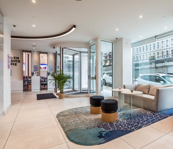 Light and spacious hotel entrance with blue and purple accents 