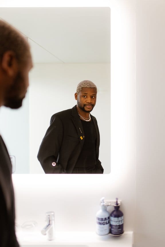 A man looks into the mirror 
