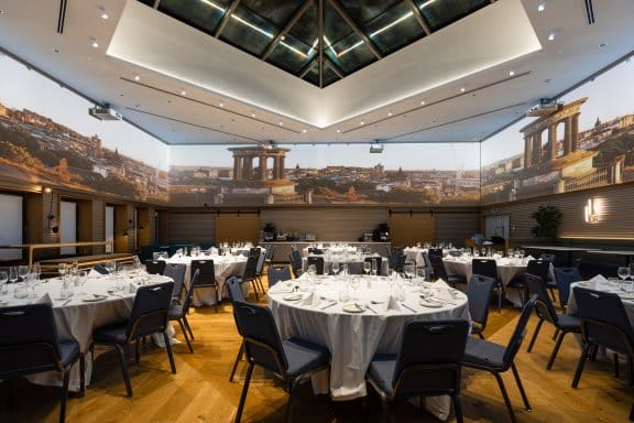 A large event space with a 360 degree screen