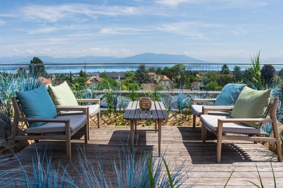 A rooftop terrace with views of the Swiss Alps