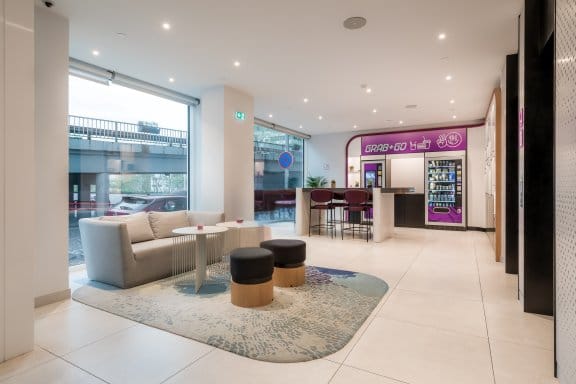 Light and spacious hotel entrance with blue and purple accents 