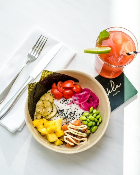 Bowl with colourful vegetables and red fruity drink