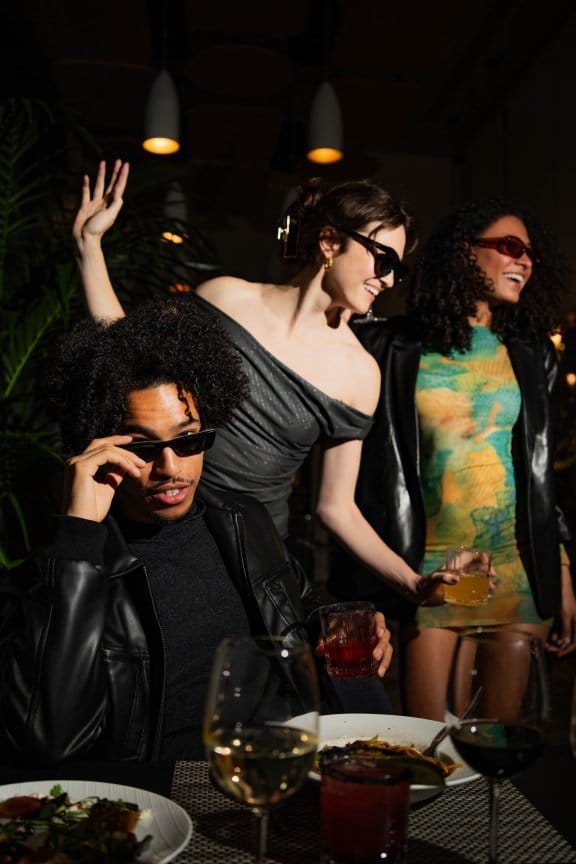 A nightclub scene with three people dancing