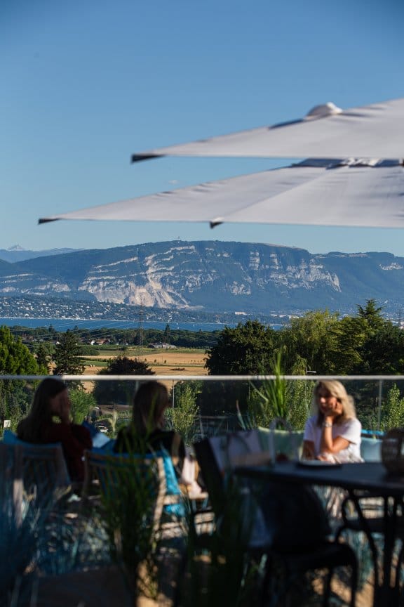 A sweeping view of the Swiss alps from an outdoor eating area