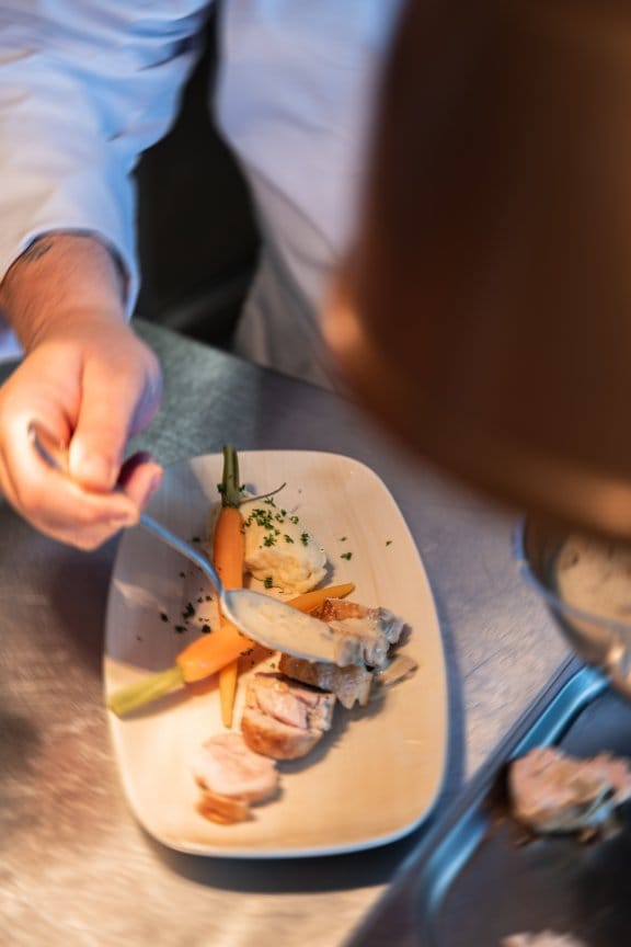 A person places his fork in a restaurant meal
