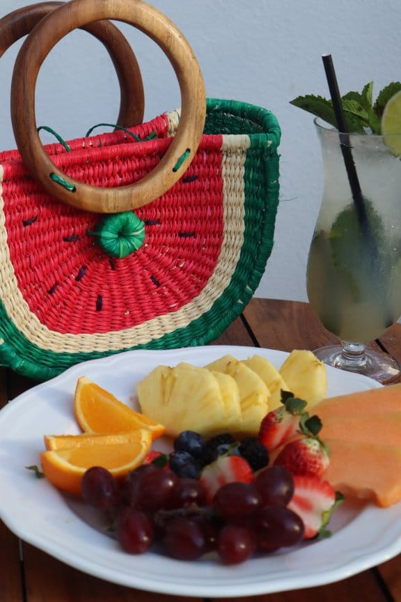 A fruit bowl and a watermelon shaped handbag