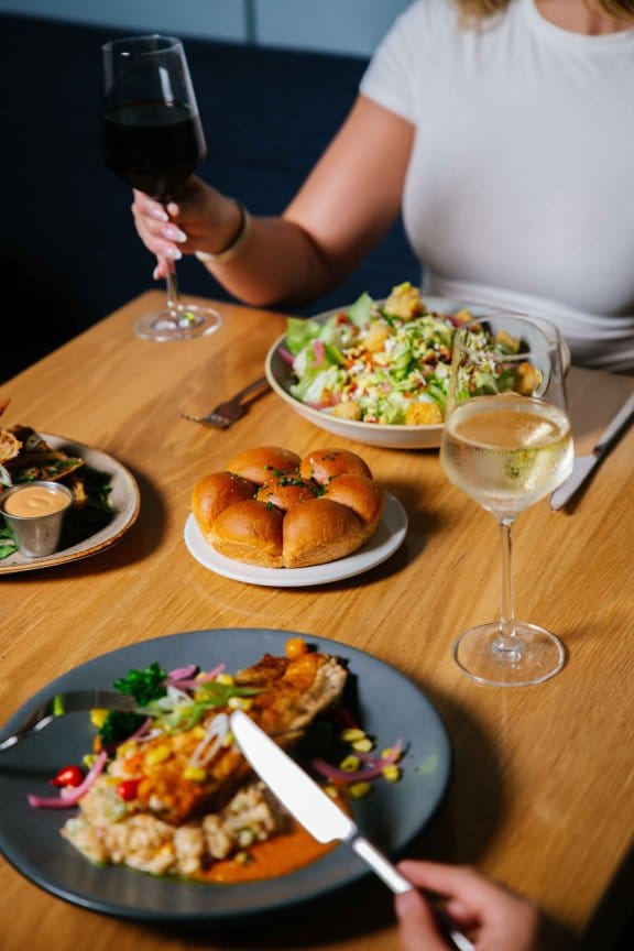 Two people enjoy a hefty meal 