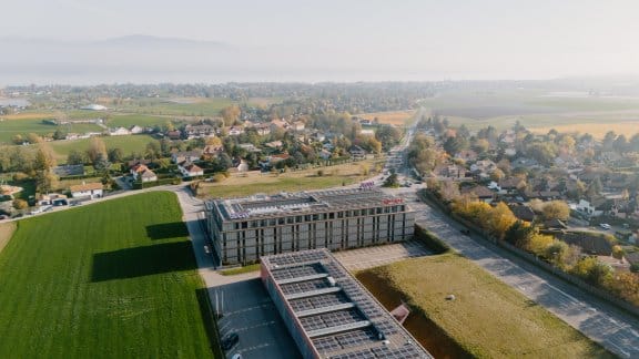 A modern hotel surrounded by greenery in the countryside