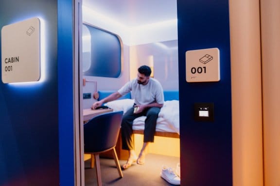 A man relaxes in cabin 001